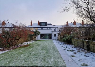 Modern rear house extension with frosted lawn and winter garden in Wicklow