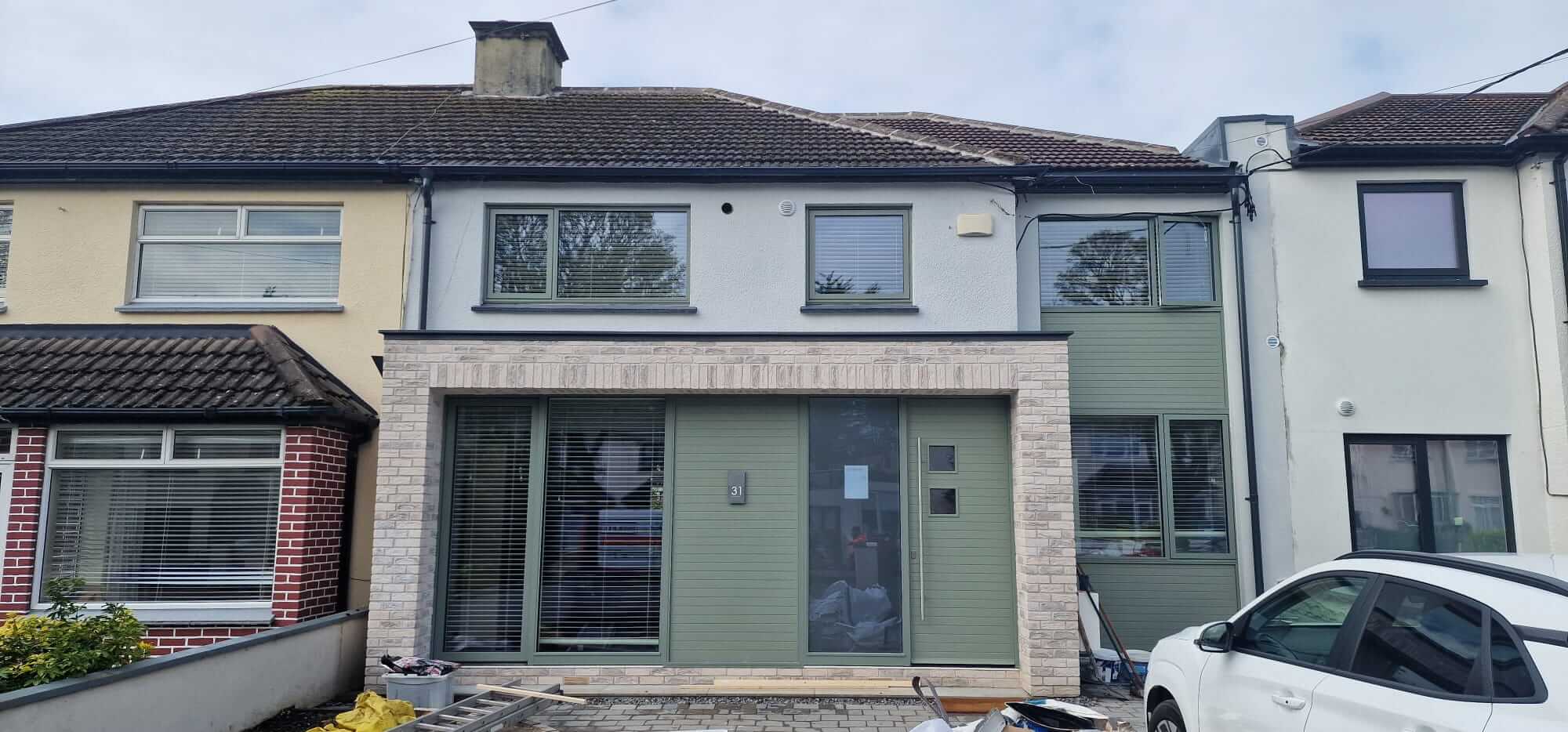 alt="Exterior front renovation and window replacement on terraced house in South Dublin by Glanmore Construction"